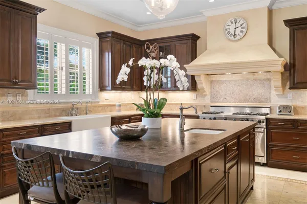 a kitchen with a table chairs and stove