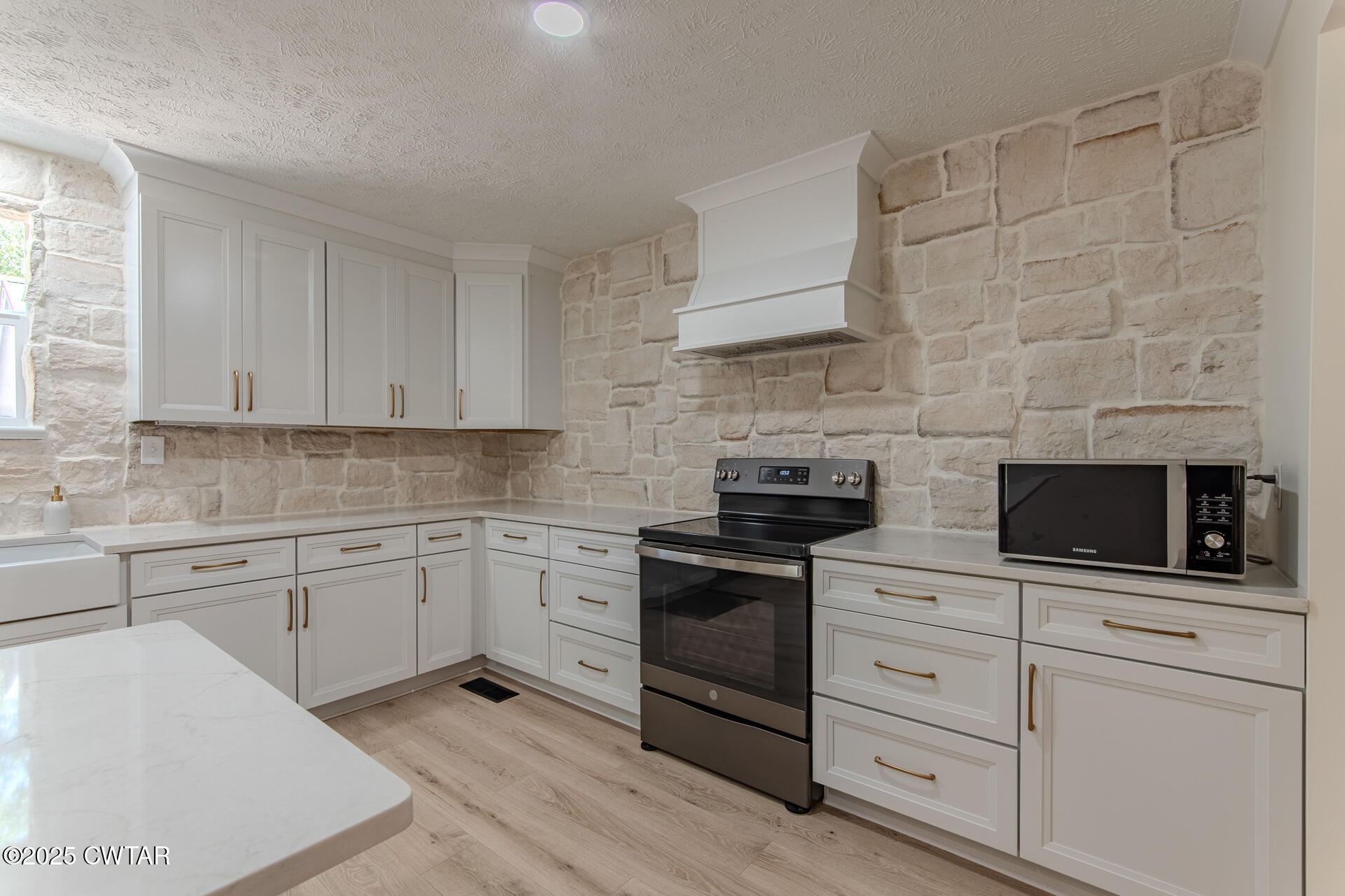 1000 Verles King Road Medon, TN 38356 - Photo 9 of 34 a kitchen with white cabinets stainless steel appliances and sink