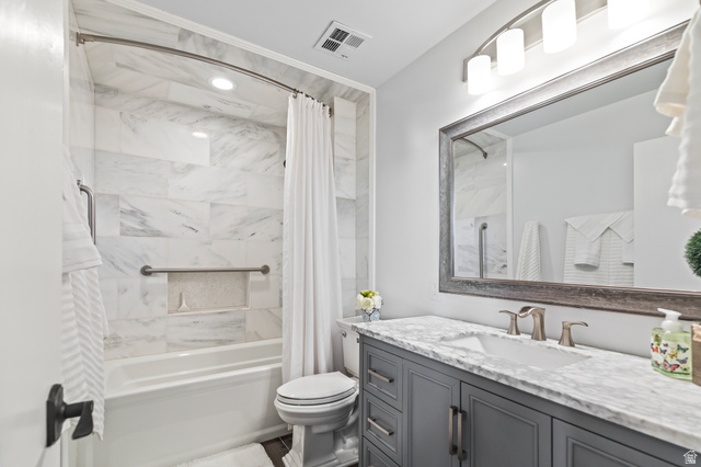 460 Omni Point Road Central Valley, UT 84754 - Photo 53 of 101 Bathroom featuring a white bathtub real marble stone tile surround, a built-in shower niche made out of abolne , and a curved shower rod