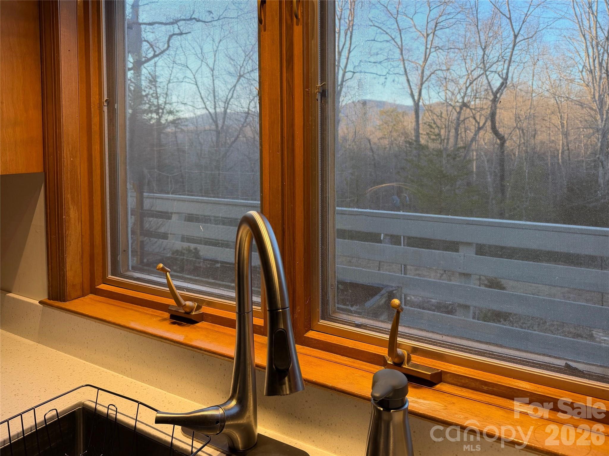 550 South River Road Tryon, NC 28782 - Photo 19 of 47 a view of a balcony with chairs