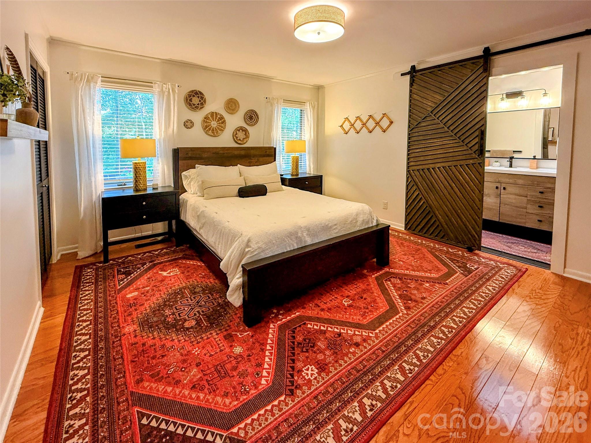 550 South River Road Tryon, NC 28782 - Photo 21 of 47 a bedroom with a large bed and a window