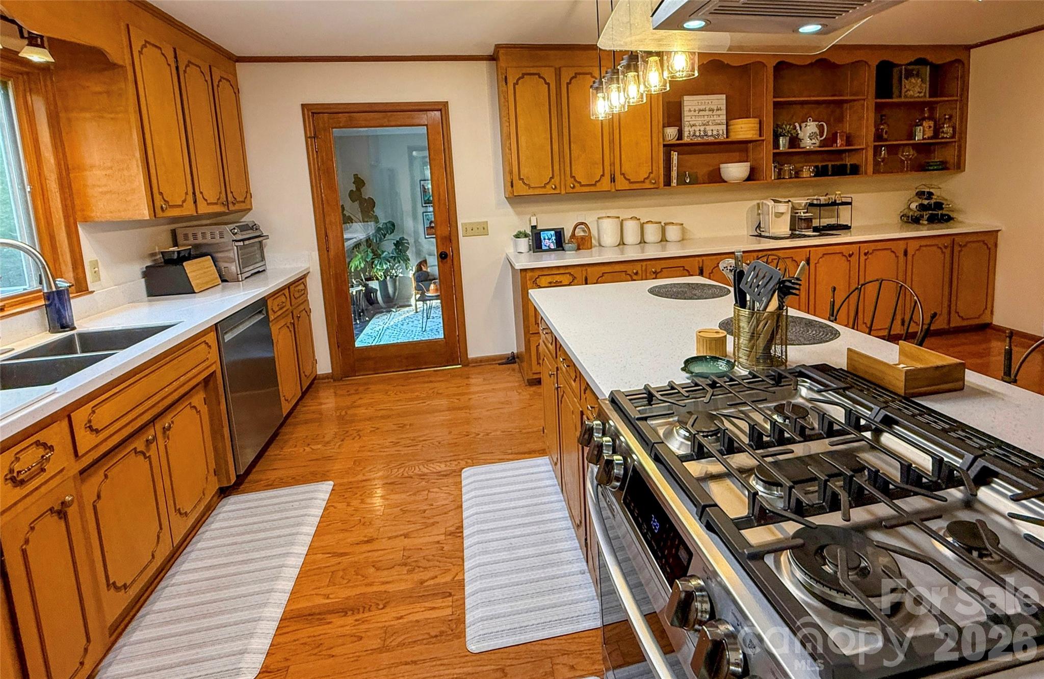 550 South River Road Tryon, NC 28782 - Photo 33 of 47 a kitchen with wooden cabinets and a stove top oven
