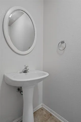 a bathroom with a sink and mirror
