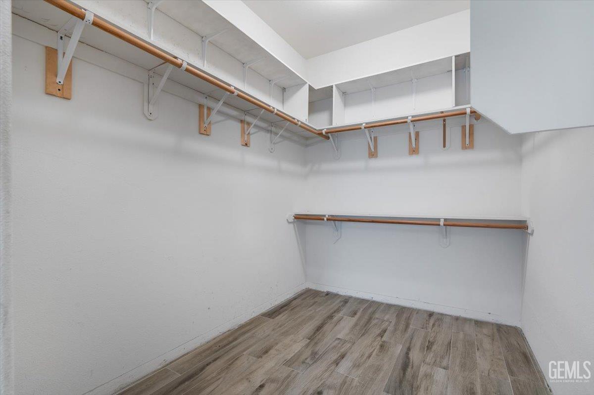 Undisclosed Address Bakersfield, CA 93312 - Photo 13 of 45 a view of an empty walk in closet