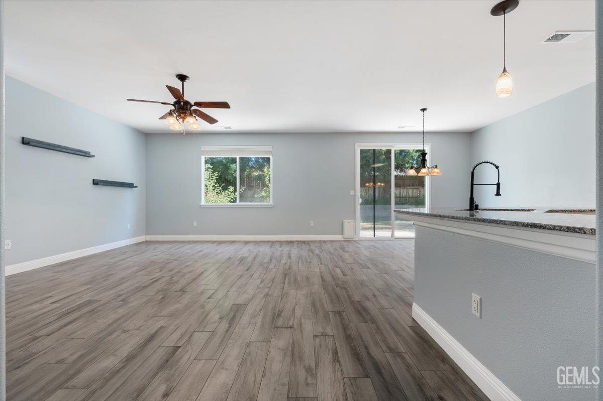 Undisclosed Address Bakersfield, CA 93312 - Photo 30 of 45 a view of a room with wooden floor and window