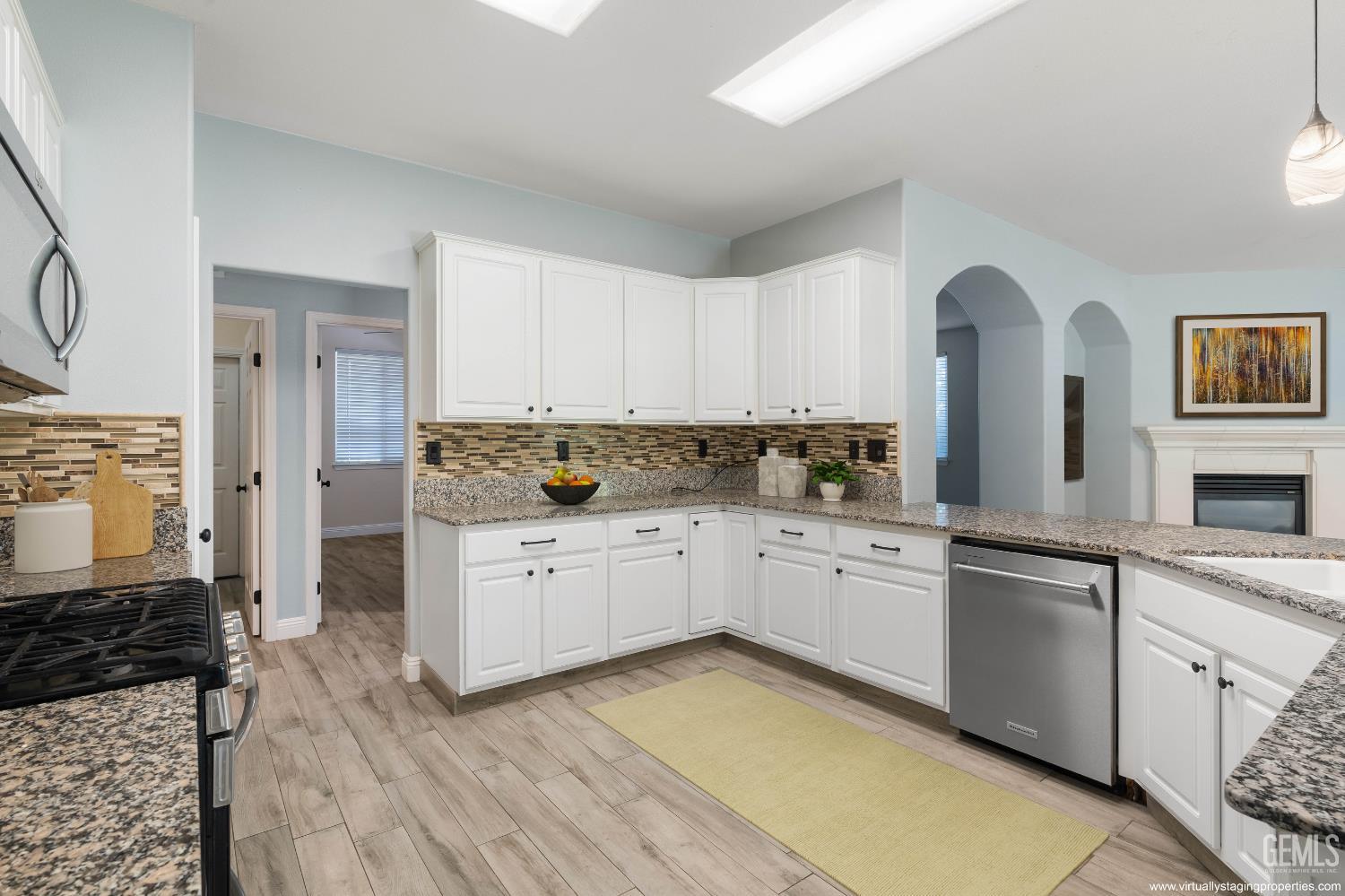 Undisclosed Address Bakersfield, CA 93312 - Photo 3 of 45 a kitchen with granite countertop white cabinets and white appliances