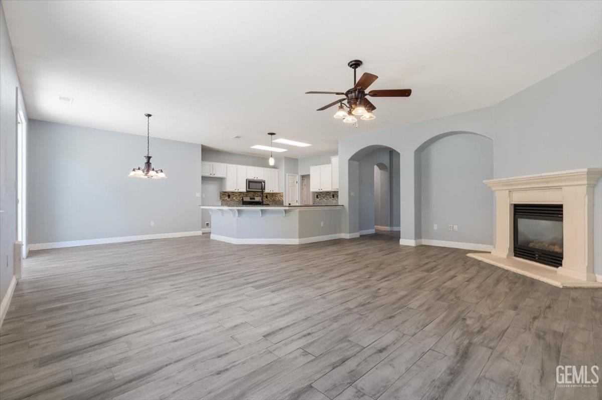 Undisclosed Address Bakersfield, CA 93312 - Photo 32 of 45 a view of a room with a ceiling fan and a ceiling fan