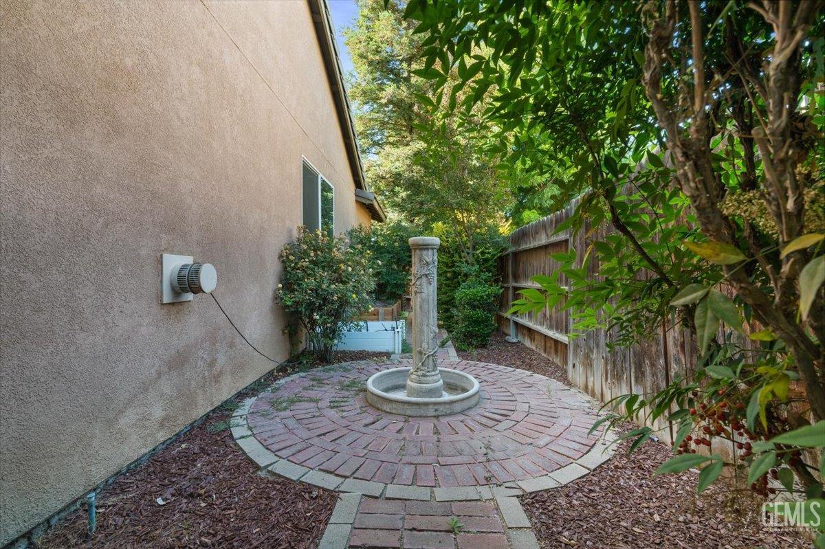 Undisclosed Address Bakersfield, CA 93312 - Photo 41 of 45 a view of a backyard with table and chairs potted plants