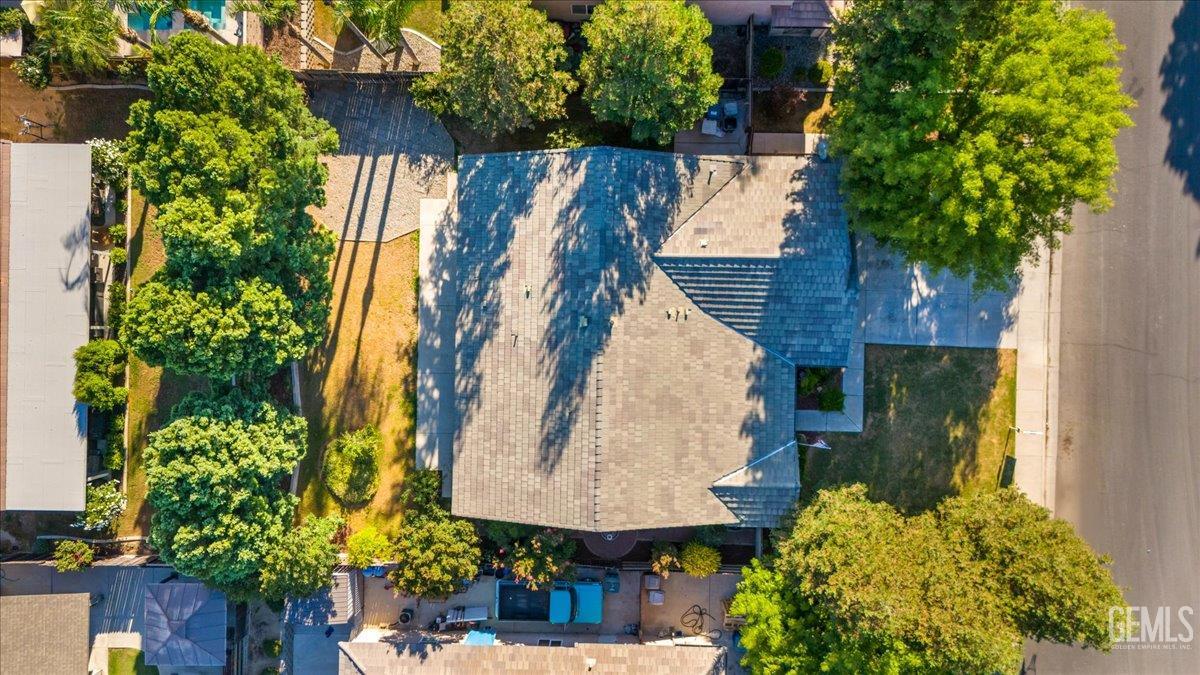 Undisclosed Address Bakersfield, CA 93312 - Photo 42 of 45 an aerial view of a house with garden space and trees