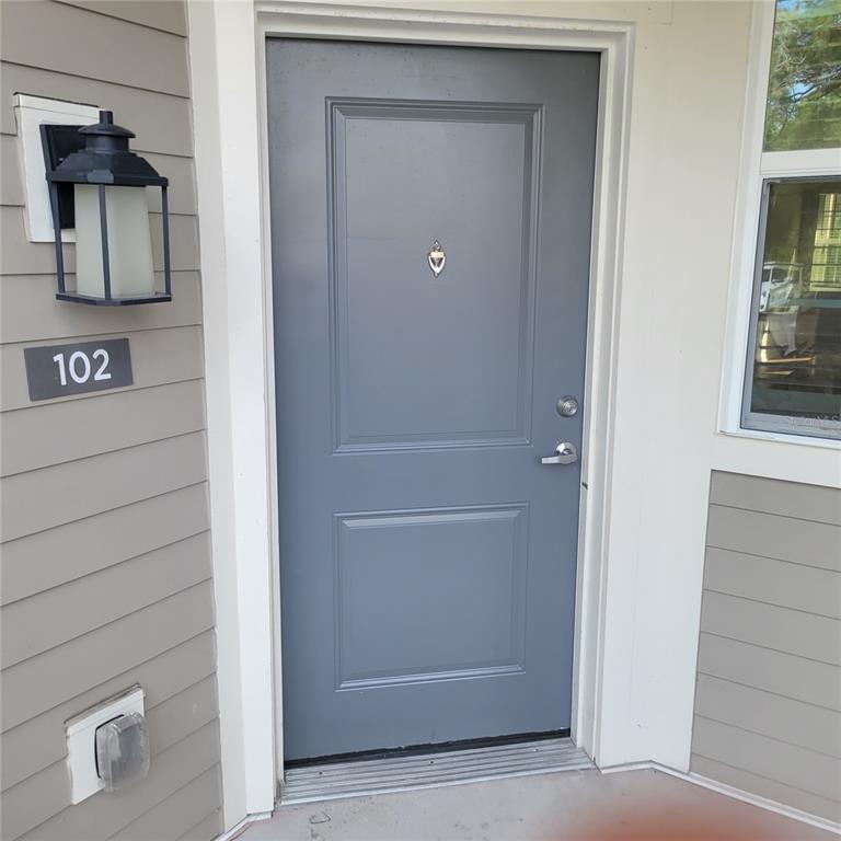 6407 Brook Village Cove, Unit 102 Bradenton, FL 34202 - Photo 2 of 19 a view of front door and closet of a house