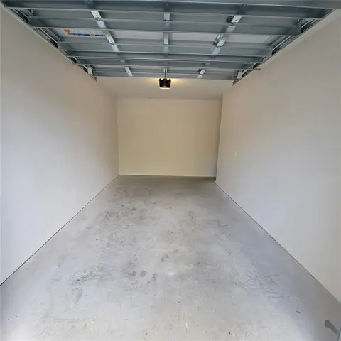 a kitchen with a sink stainless steel appliances and refrigerator