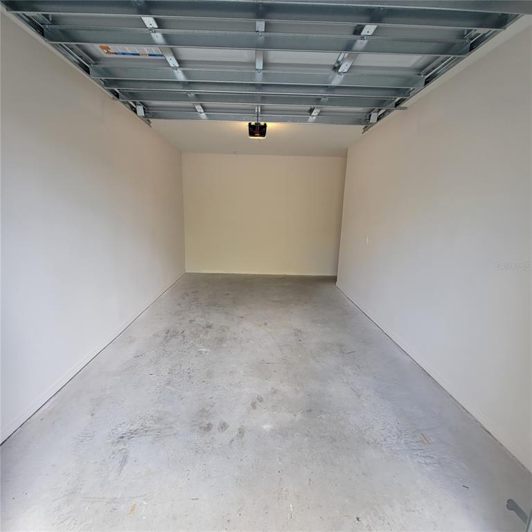 6407 Brook Village Cove, Unit 102 Bradenton, FL 34202 - Photo 4 of 19 a view of garage