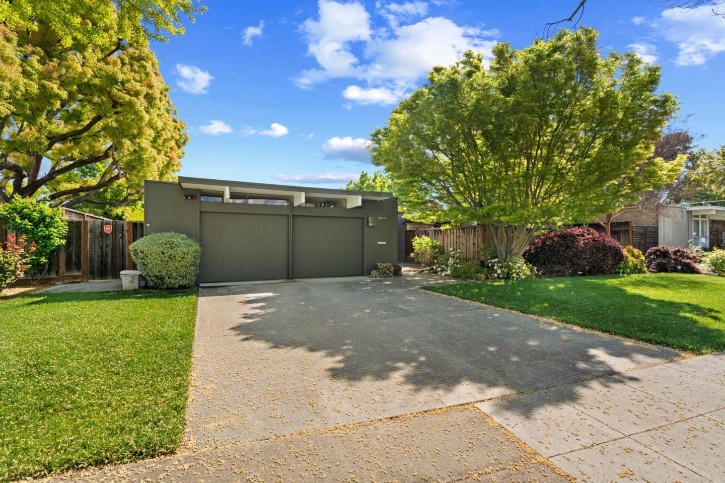 2018 Adele Place San Jose, CA 95125 - Photo 2 of 46 a front view of a house with a yard garage and a garage