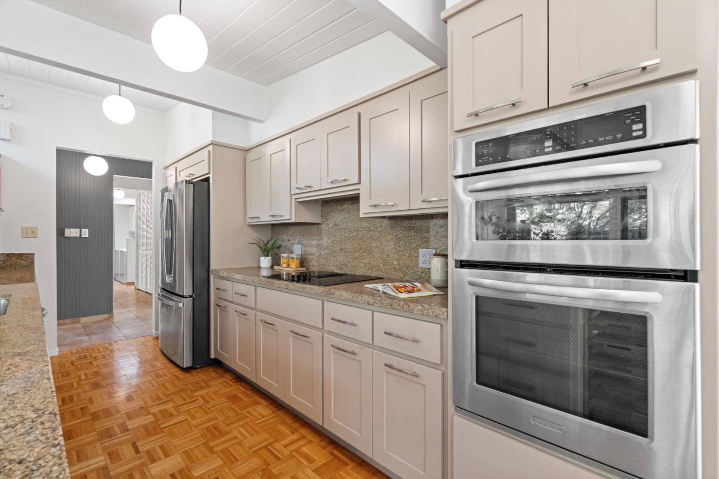 2018 Adele Place San Jose, CA 95125 - Photo 23 of 46 a kitchen with stainless steel appliances granite countertop a stove and a refrigerator