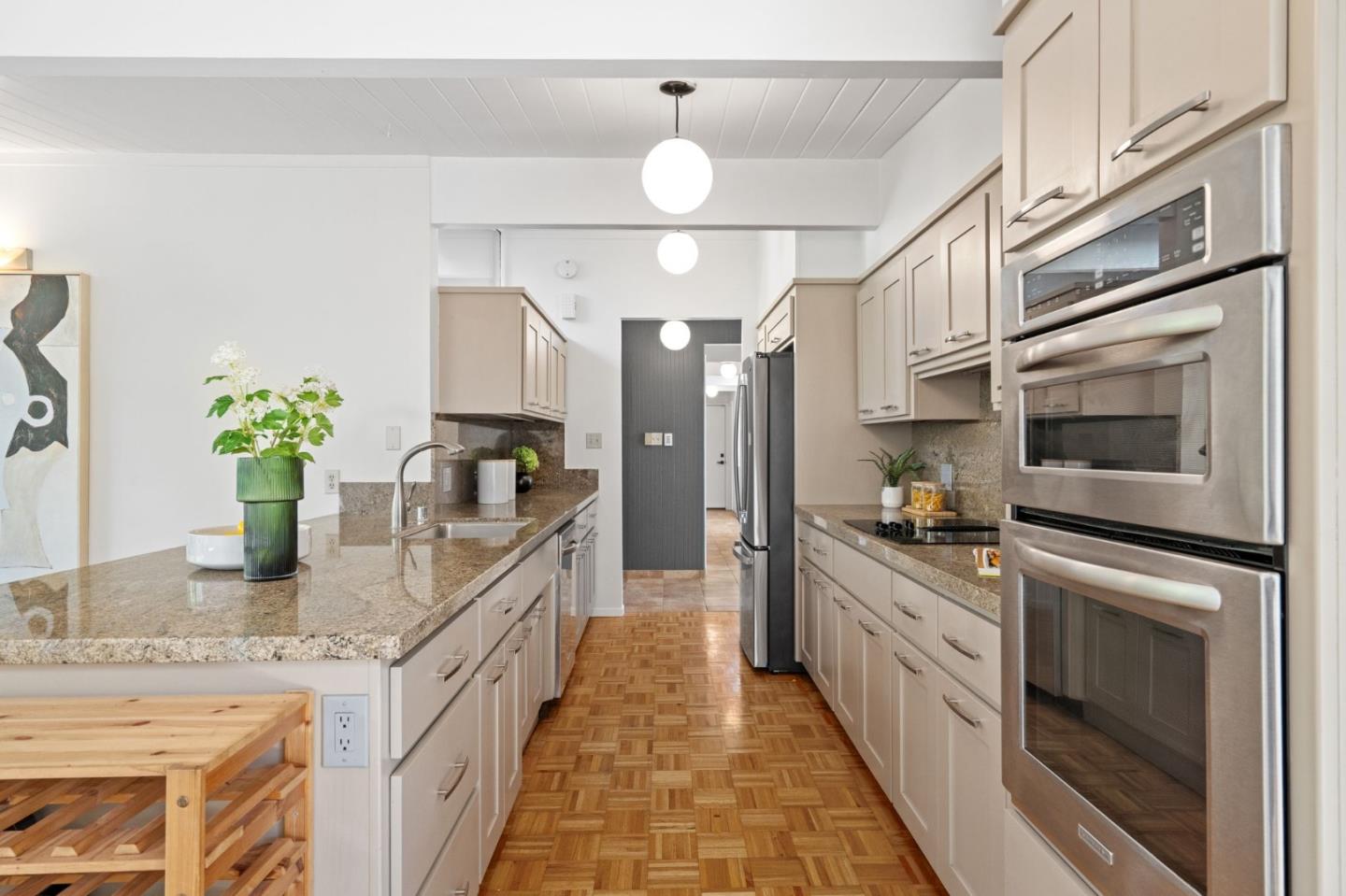 2018 Adele Place San Jose, CA 95125 - Photo 24 of 46 a kitchen with stainless steel appliances granite countertop a stove a sink and a refrigerator