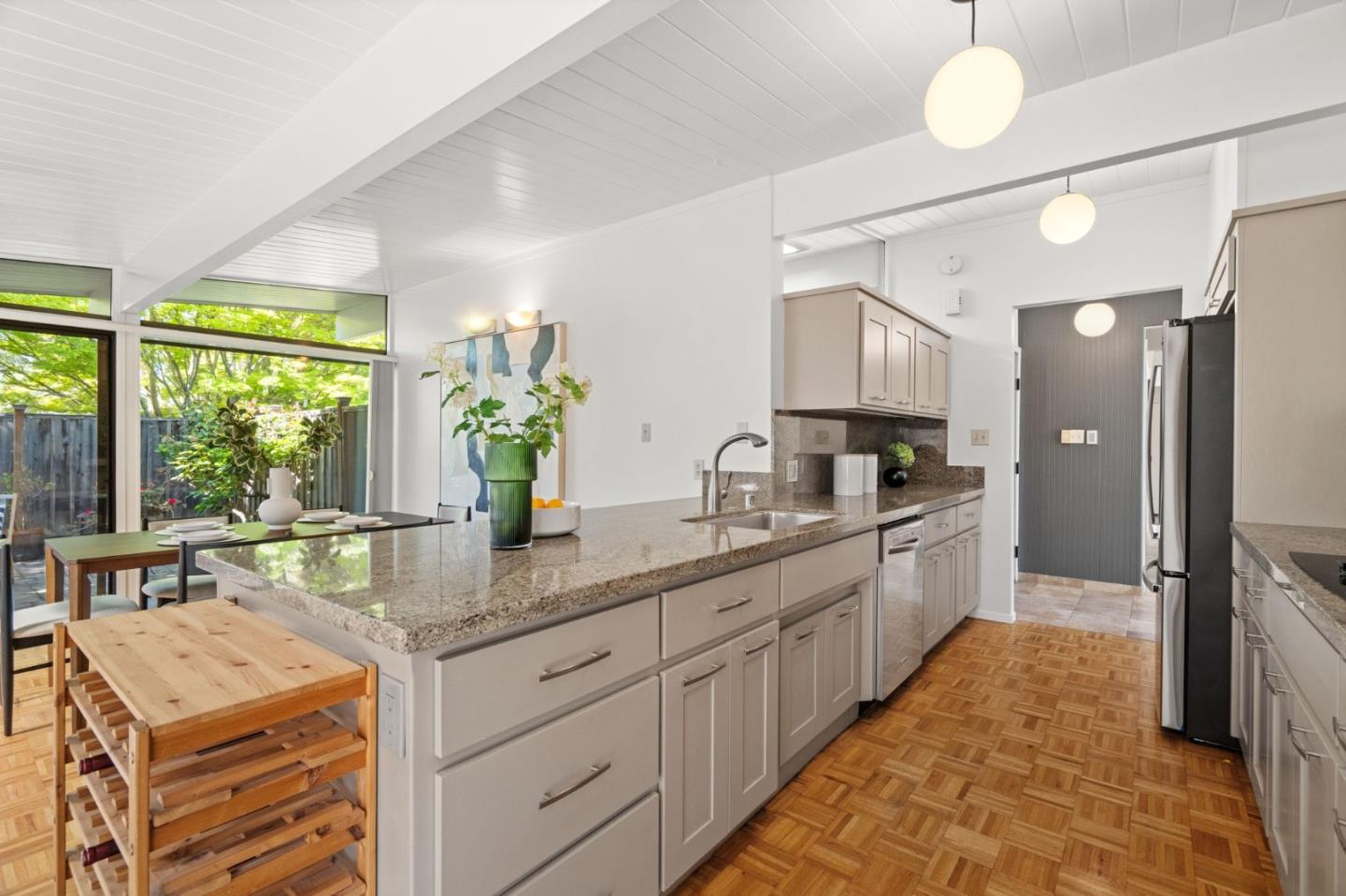 2018 Adele Place San Jose, CA 95125 - Photo 25 of 46 a kitchen with stainless steel appliances kitchen island granite countertop a sink and cabinets