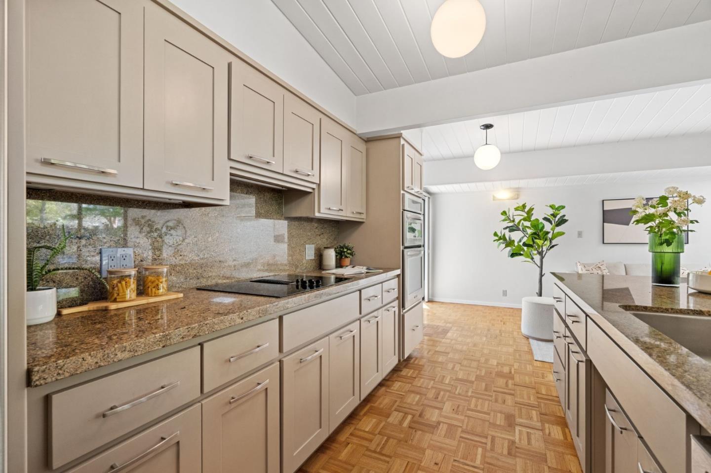 2018 Adele Place San Jose, CA 95125 - Photo 27 of 46 a kitchen with granite countertop a sink and white cabinets