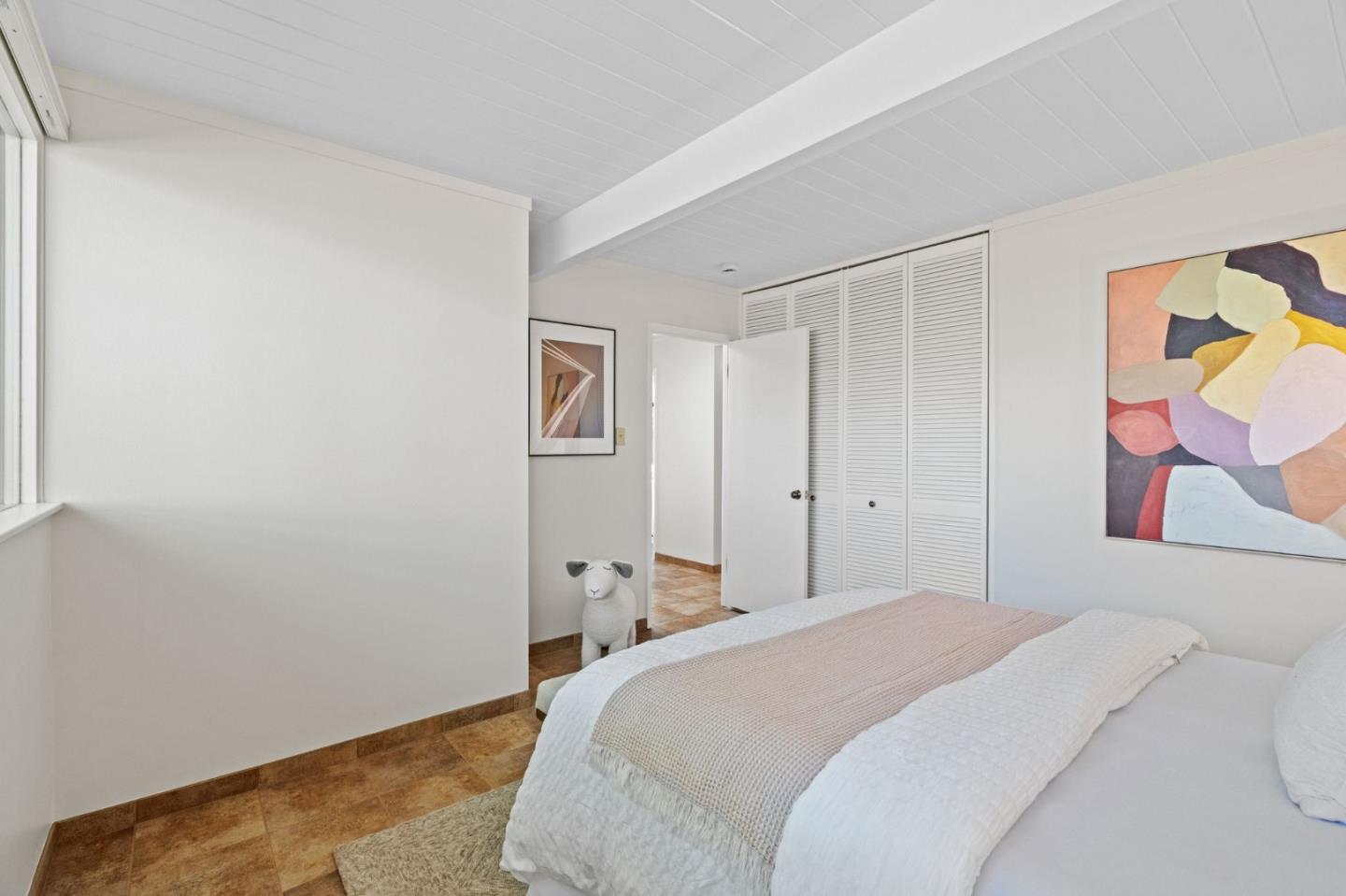 2018 Adele Place San Jose, CA 95125 - Photo 31 of 46 a bedroom with a bed and painting on the wall