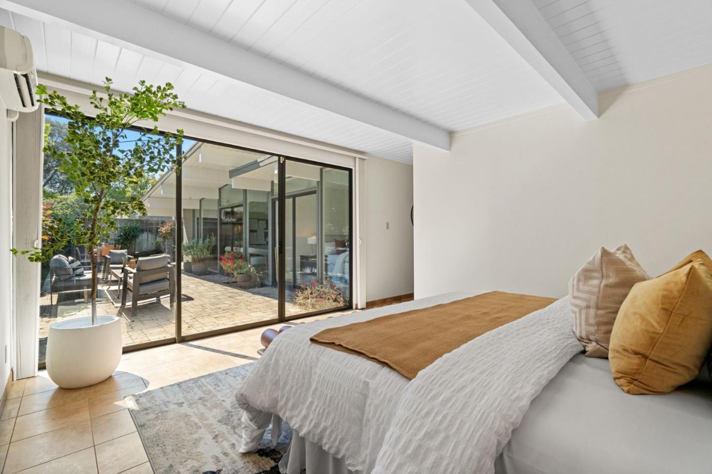 2018 Adele Place San Jose, CA 95125 - Photo 37 of 46 a bedroom with a large bed and a potted plant