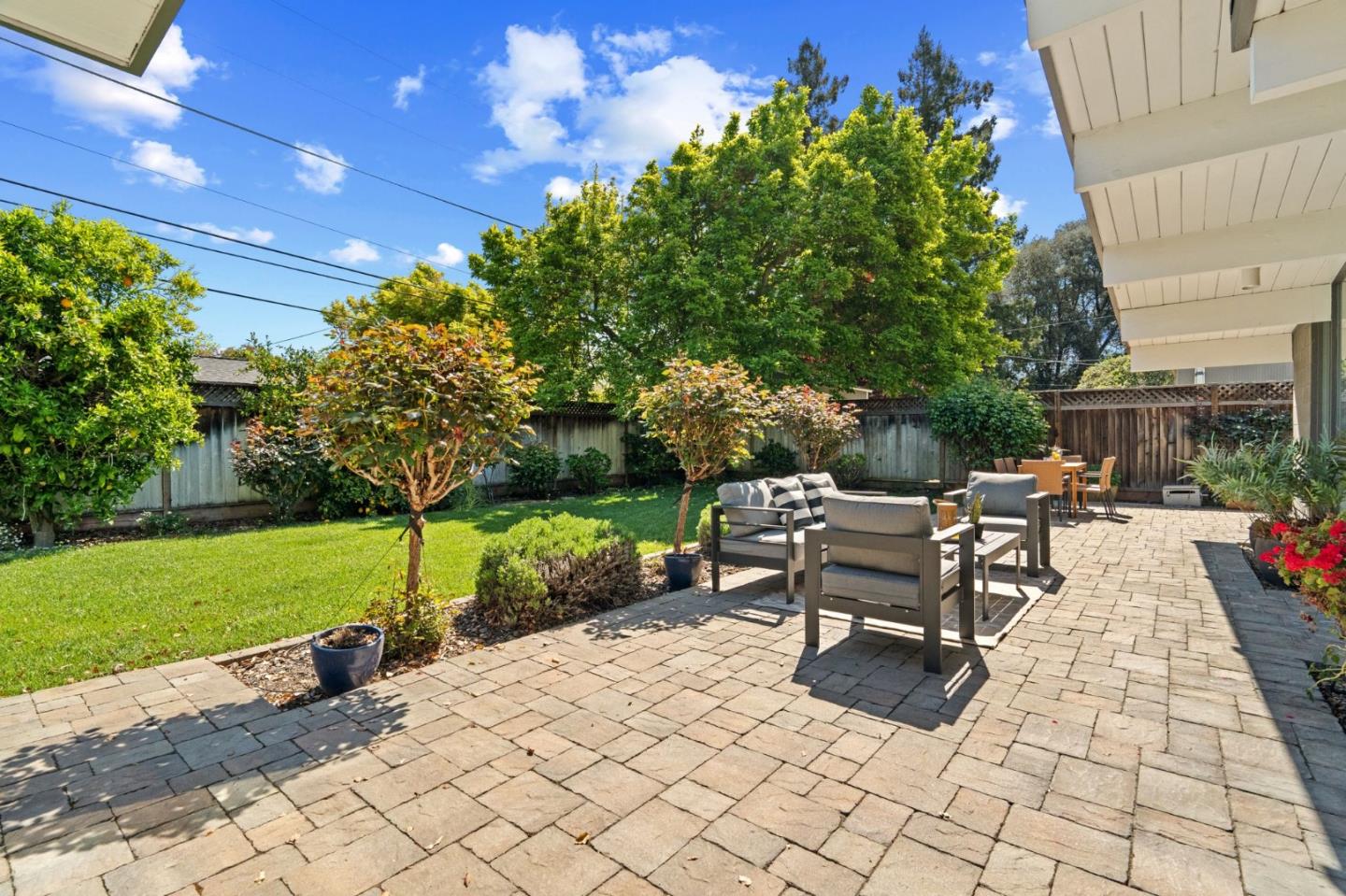 2018 Adele Place San Jose, CA 95125 - Photo 45 of 46 a view of a patio with a dining table and chairs with a fire pit