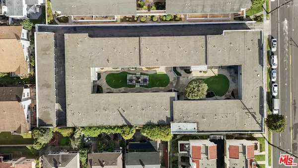 an aerial view of a house with outdoor space