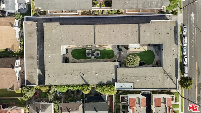 an aerial view of a house with outdoor space