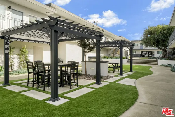 a view of a porch with furniture and a table