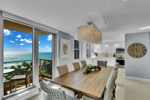 a view of a dining room with furniture window and outside view