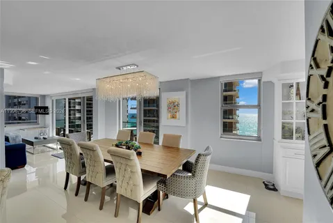 a view of a dining room with furniture and window