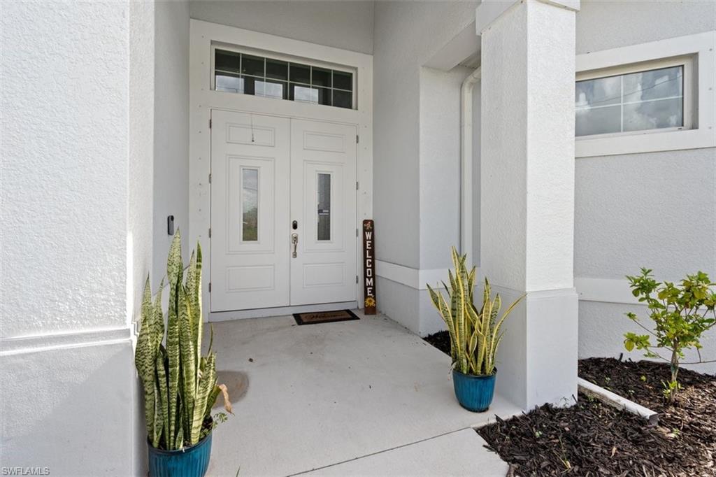 3611 8th Street Southwest Lehigh Acres, FL 33976 - Photo 2 of 21 a view of entryway with wooden floor