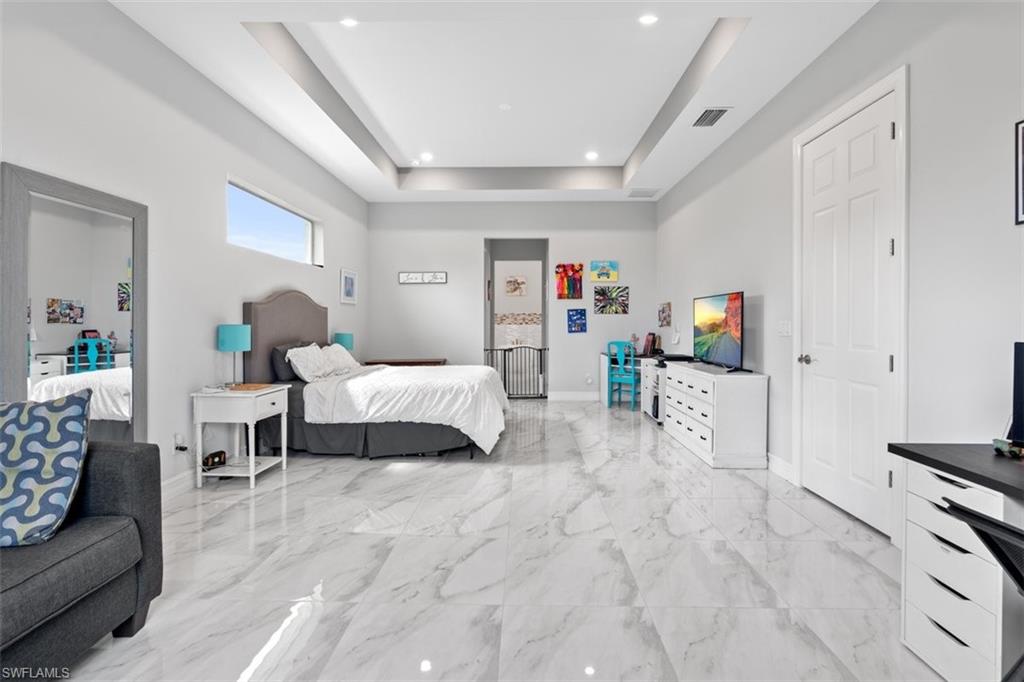 3611 8th Street Southwest Lehigh Acres, FL 33976 - Photo 9 of 21 a bedroom with furniture and a couch