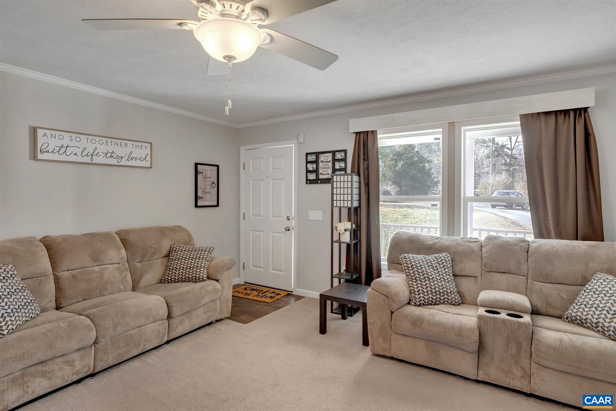 4491 Amicus Road Ruckersville, VA 22968 - Photo 12 of 37 a living room with furniture and a large window