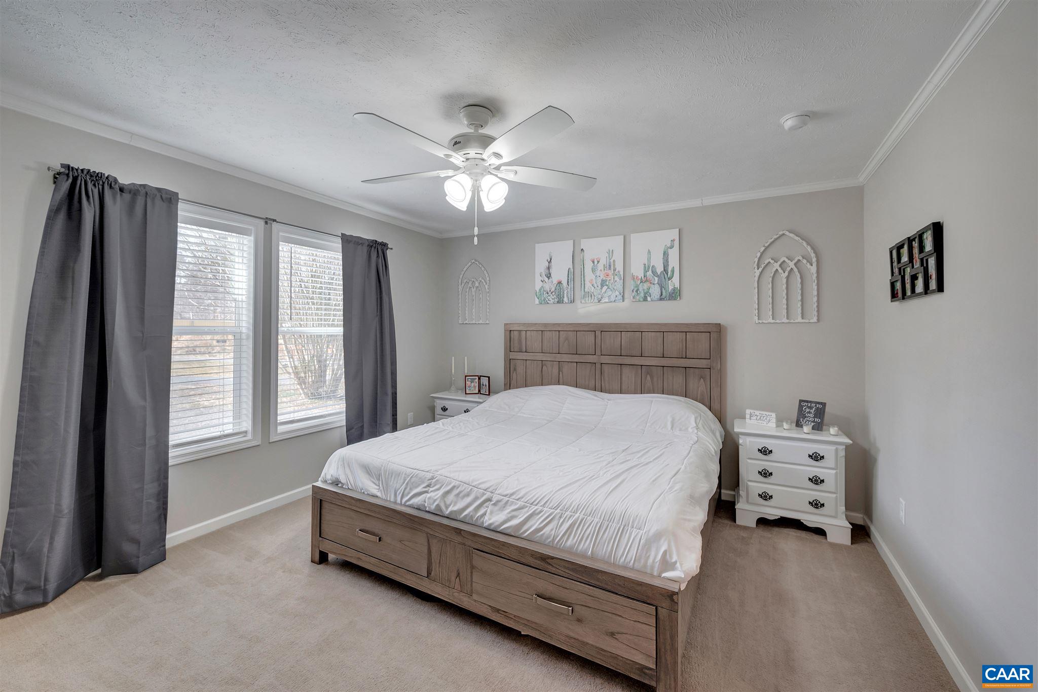 4491 Amicus Road Ruckersville, VA 22968 - Photo 14 of 37 a spacious bedroom with a bed and a window