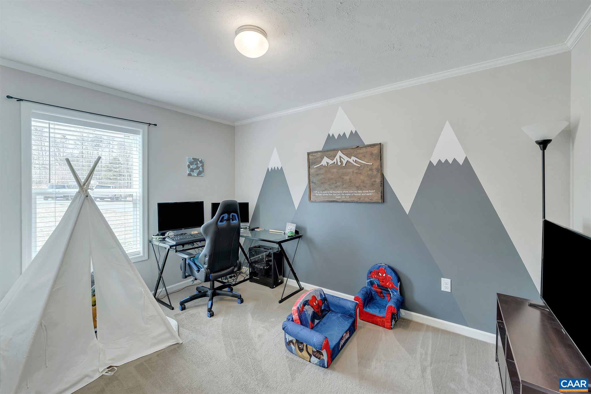 4491 Amicus Road Ruckersville, VA 22968 - Photo 22 of 37 a room with furniture and a flat screen tv