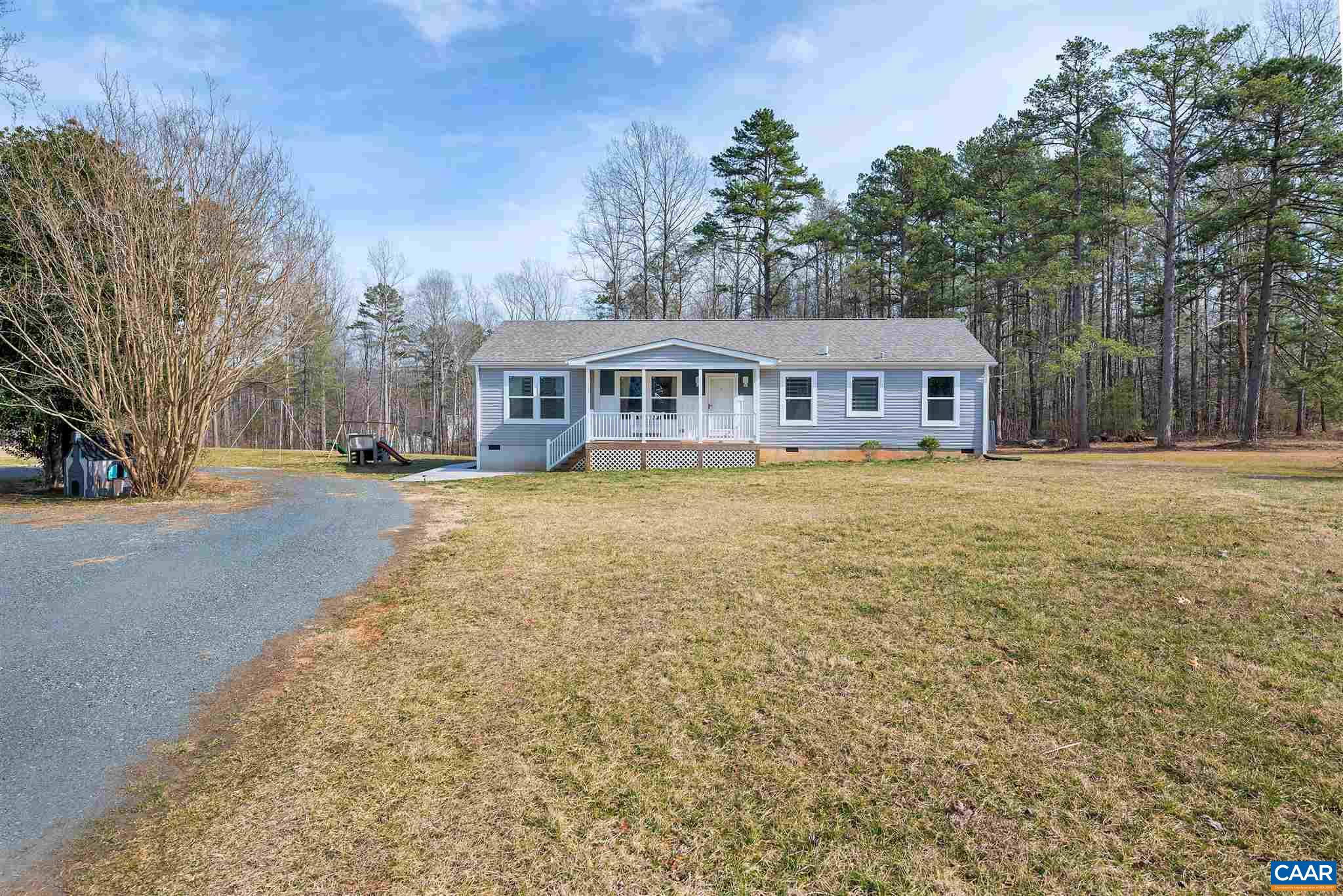 4491 Amicus Road Ruckersville, VA 22968 - Photo 35 of 37 a view of a house with a big yard and large trees
