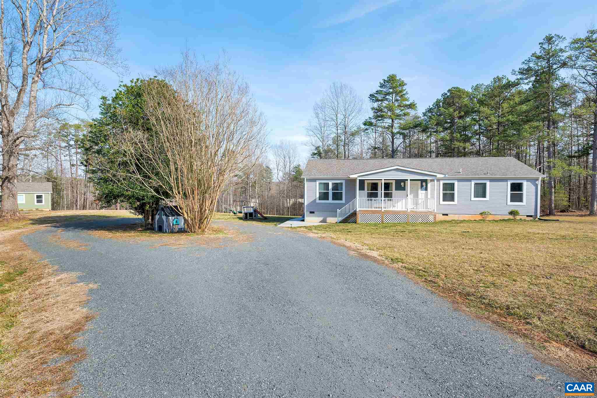 4491 Amicus Road Ruckersville, VA 22968 - Photo 36 of 37 a view of house with outdoor space and trees around