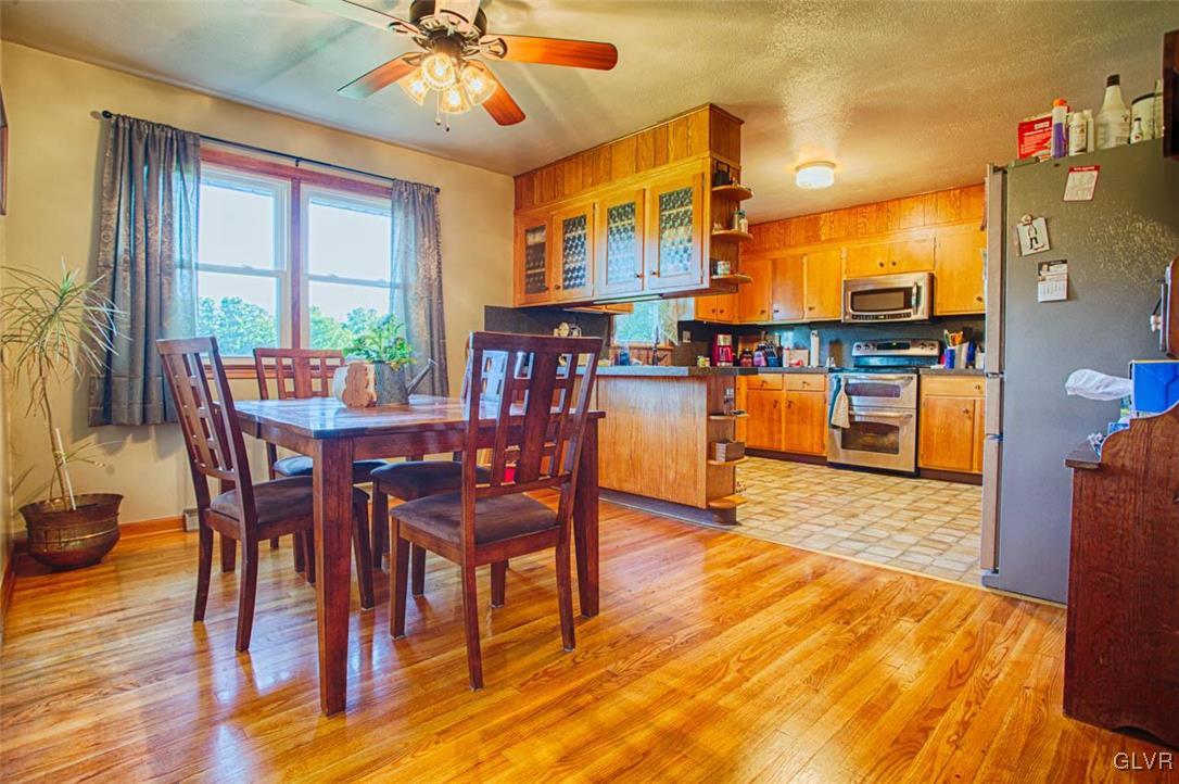 1239 Bushkill Center Road Nazareth, PA 18064 - Photo 2 of 14 a dining room with furniture window and wooden floor