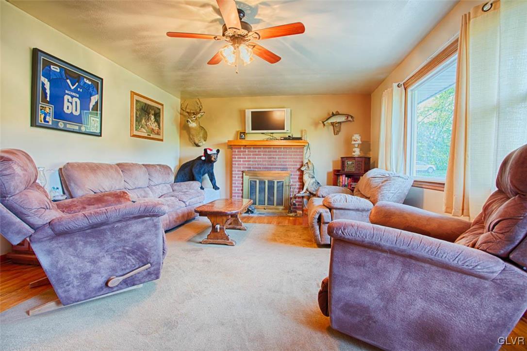 1239 Bushkill Center Road Nazareth, PA 18064 - Photo 4 of 14 a living room with furniture and a fireplace