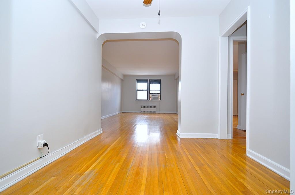 142 Garth Road, Unit 5S Scarsdale, NY 10583 - Photo 18 of 40 a view of a room with wooden floor and window