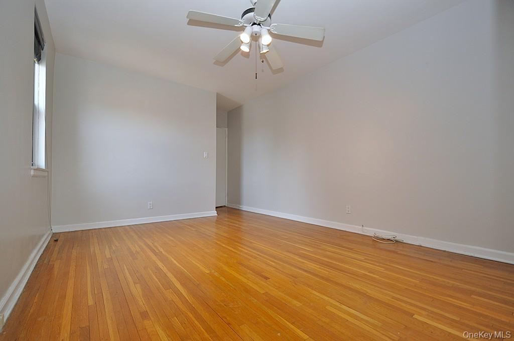 142 Garth Road, Unit 5S Scarsdale, NY 10583 - Photo 24 of 40 wooden floor in an empty room