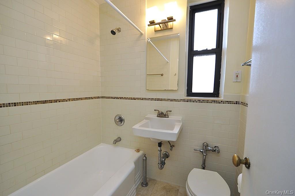142 Garth Road, Unit 5S Scarsdale, NY 10583 - Photo 25 of 40 a bathroom with a sink and a toilet