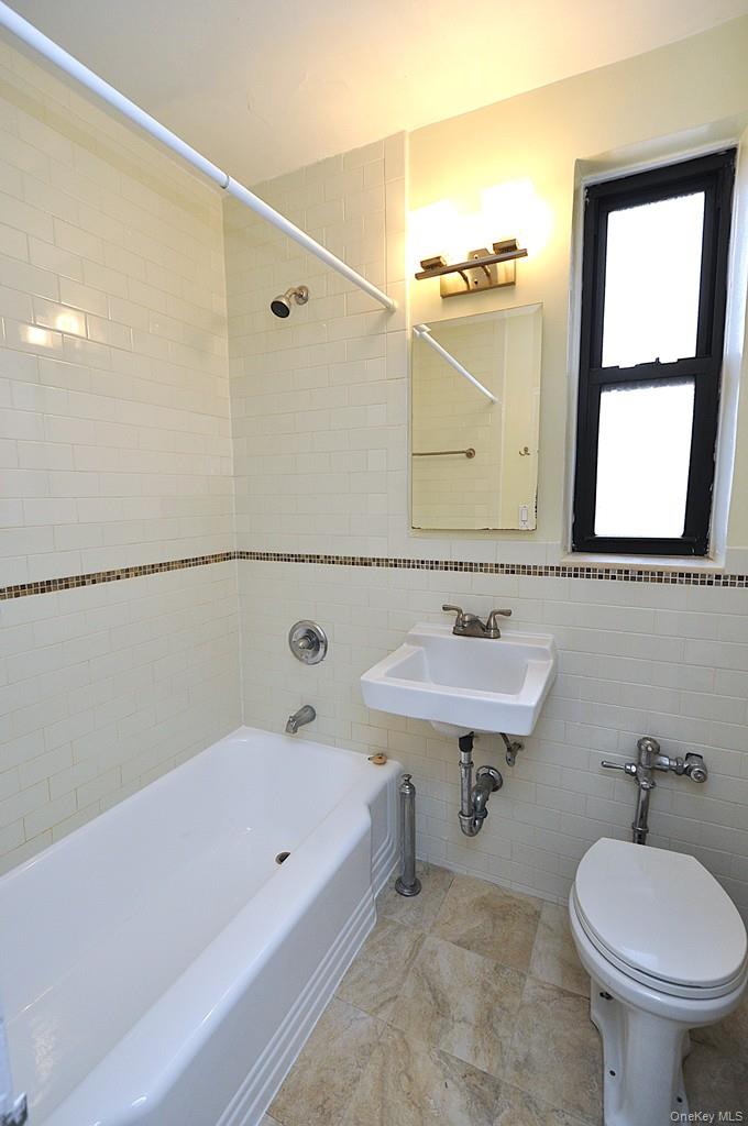 142 Garth Road, Unit 5S Scarsdale, NY 10583 - Photo 26 of 40 a bathroom with a sink and a toilet