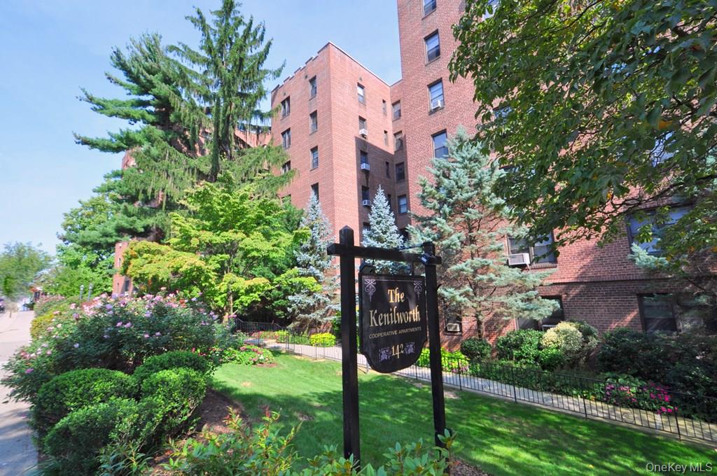 142 Garth Road, Unit 5S Scarsdale, NY 10583 - Photo 3 of 40 an aerial view of a house with a yard and garden