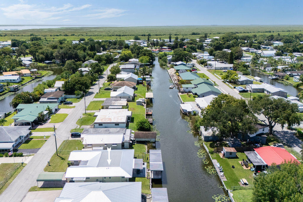 1044 4th Street Okeechobee, FL 34974 - Photo 6 of 39 an aerial view of residential houses with outdoor space