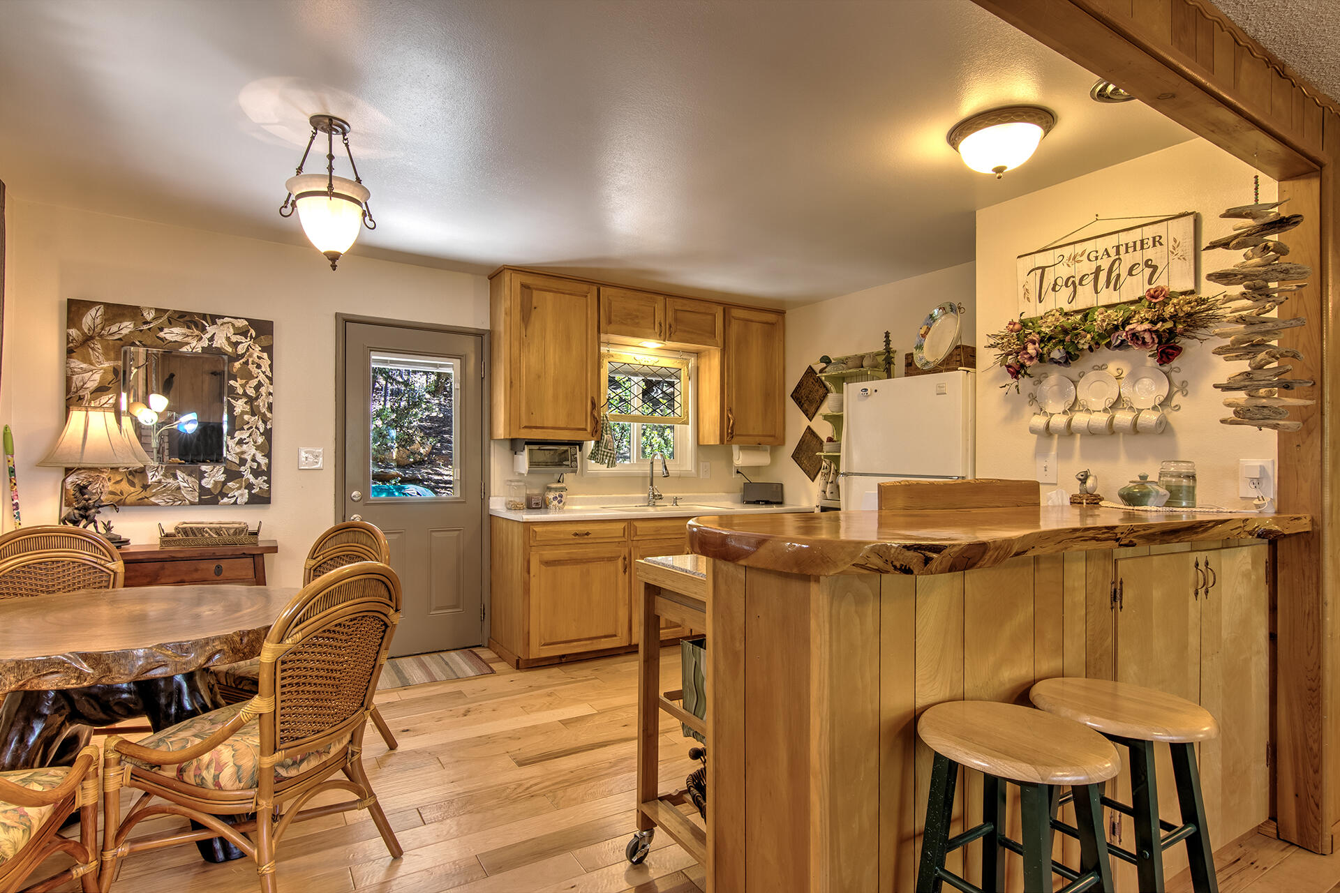 25770 Scenic Drive Idyllwild, CA 92549 - Photo 23 of 51 a view of a dining room with furniture and chandelier