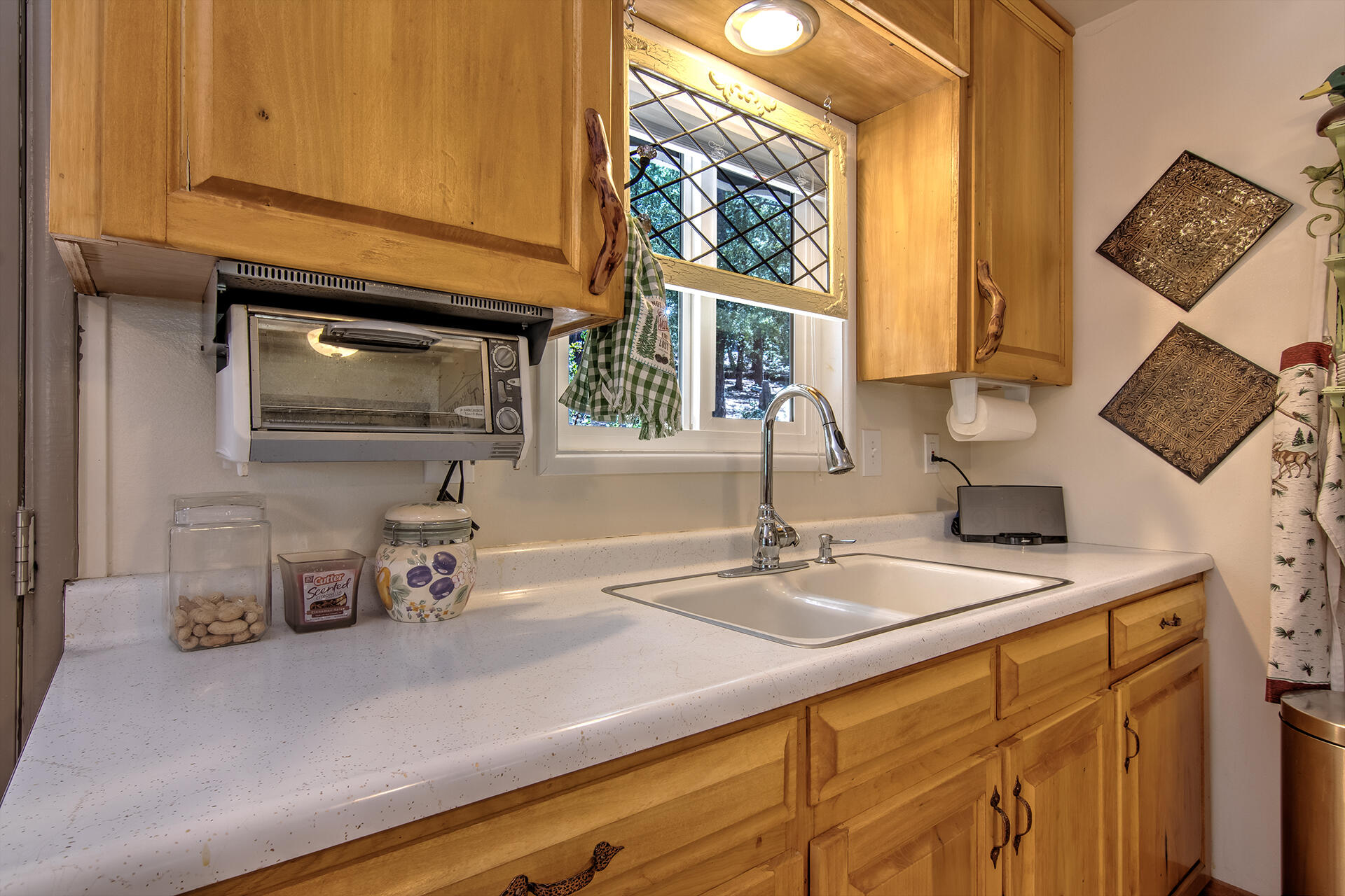 25770 Scenic Drive Idyllwild, CA 92549 - Photo 29 of 51 a kitchen with a sink cabinets and a window
