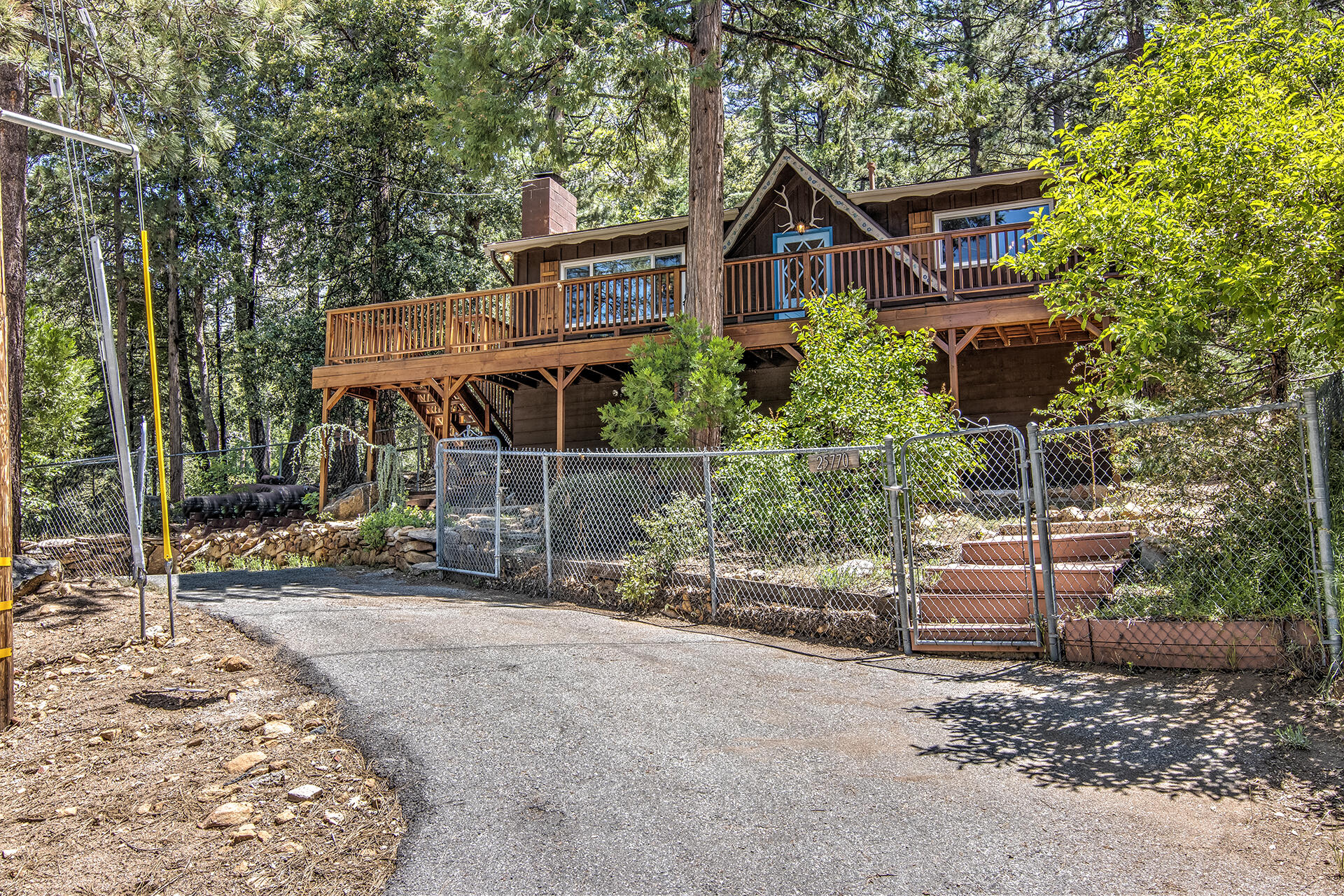 25770 Scenic Drive Idyllwild, CA 92549 - Photo 3 of 51 a front view of a house with a porch