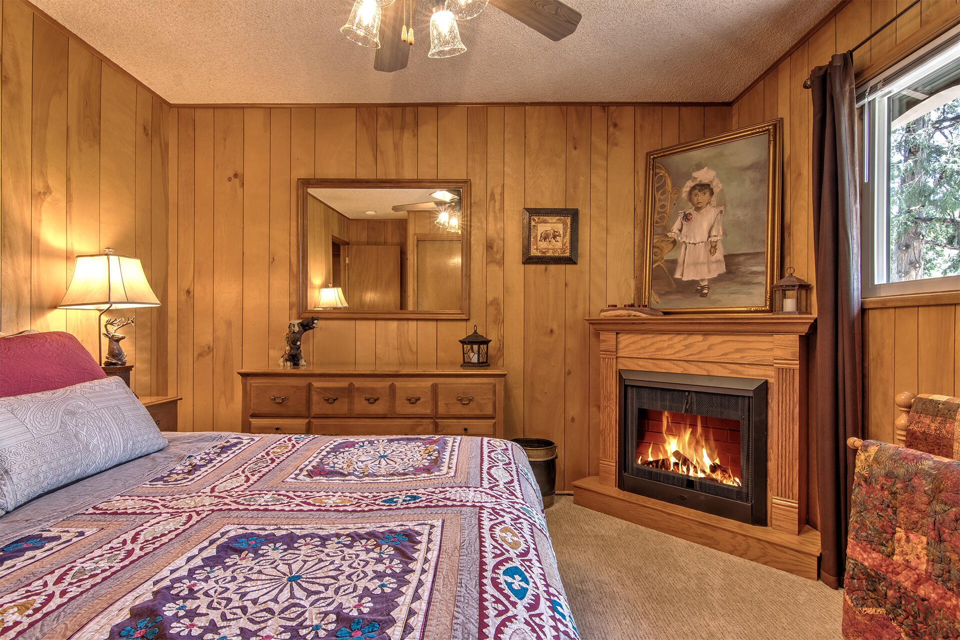 25770 Scenic Drive Idyllwild, CA 92549 - Photo 34 of 51 a bedroom with a bed and a fireplace