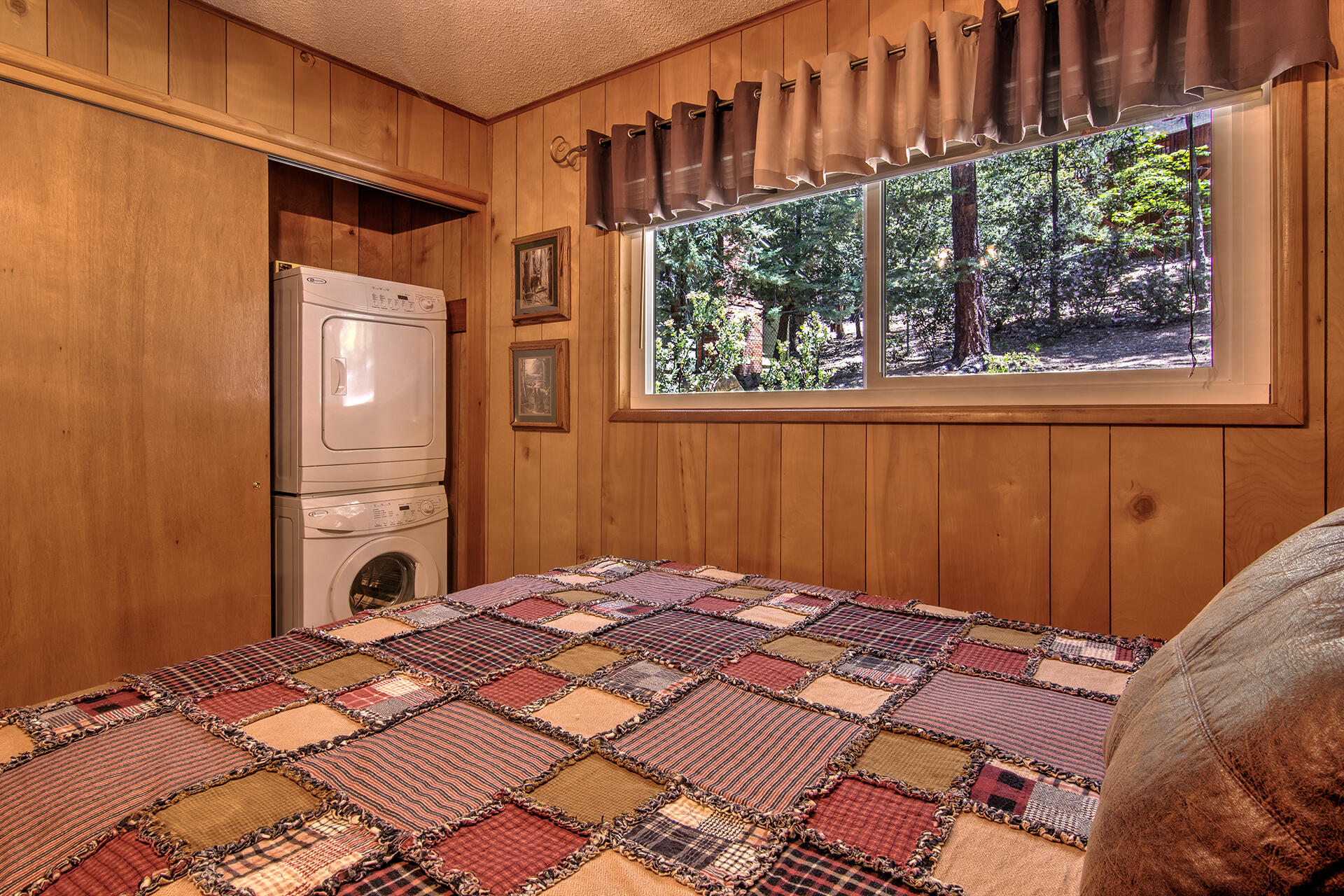 25770 Scenic Drive Idyllwild, CA 92549 - Photo 38 of 51 a bed sitting in a bedroom next to a window