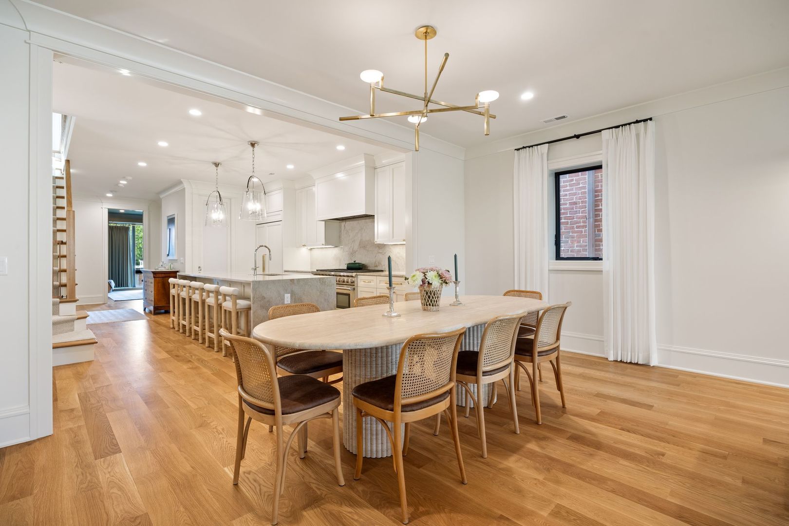 2034 North Mohawk Street, Unit 3 Chicago, IL 60614 - Photo 12 of 46 a dining room with stainless steel appliances kitchen island granite countertop a table chairs and a refrigerator